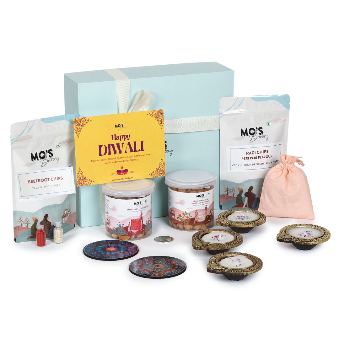 Mo’s Blue Gift Box Raspberry & apple cinnemon  Cookies – 2 Cookies, 4 Diyas, 2 Coasters, Roli Tikka Chawal Set & Potli Pouches