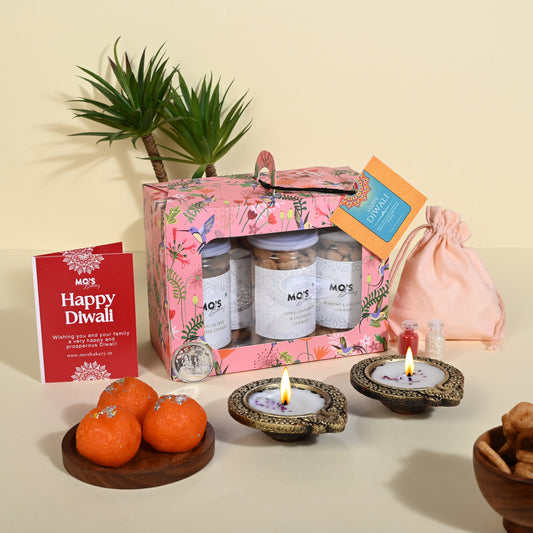 Premium Diwali Gift – Pink Cookie Box (Set of 4 Flavours) with Diyas, Roli Tikka Pouch & Greeting Card